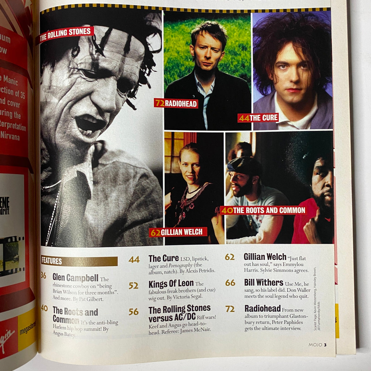 Inside page of Mojo Music Magazine August 2003 highlighting features on Radiohead, The Cure, and Glen Campbell with their respective photos.