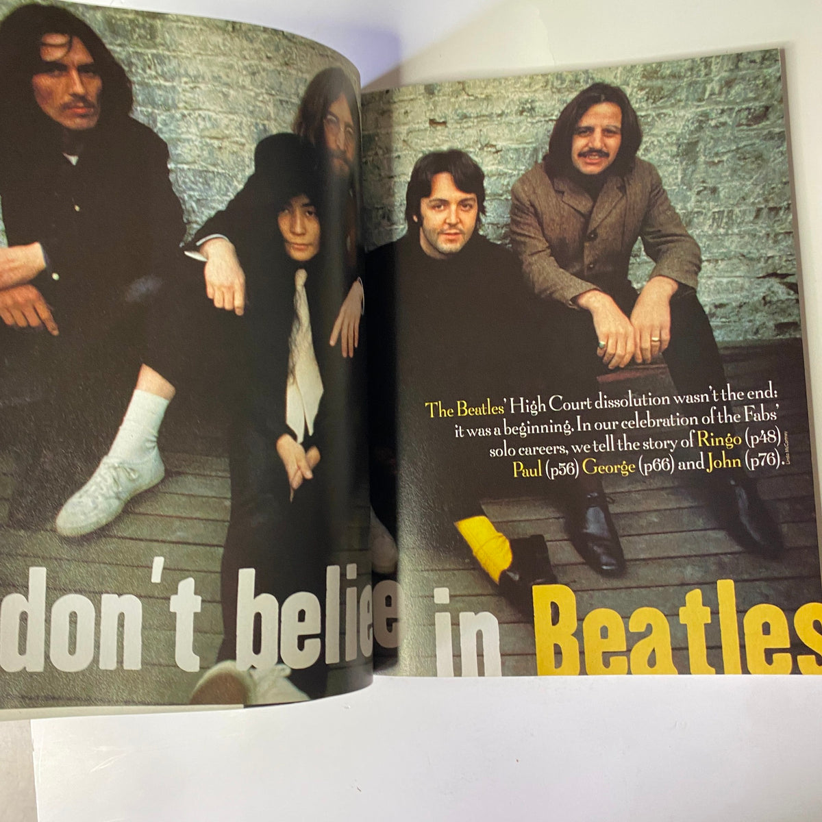An inside spread from Mojo Music Magazine July 2001 depicting The Beatles, features a retrospective on their legacy with notable members seated together.