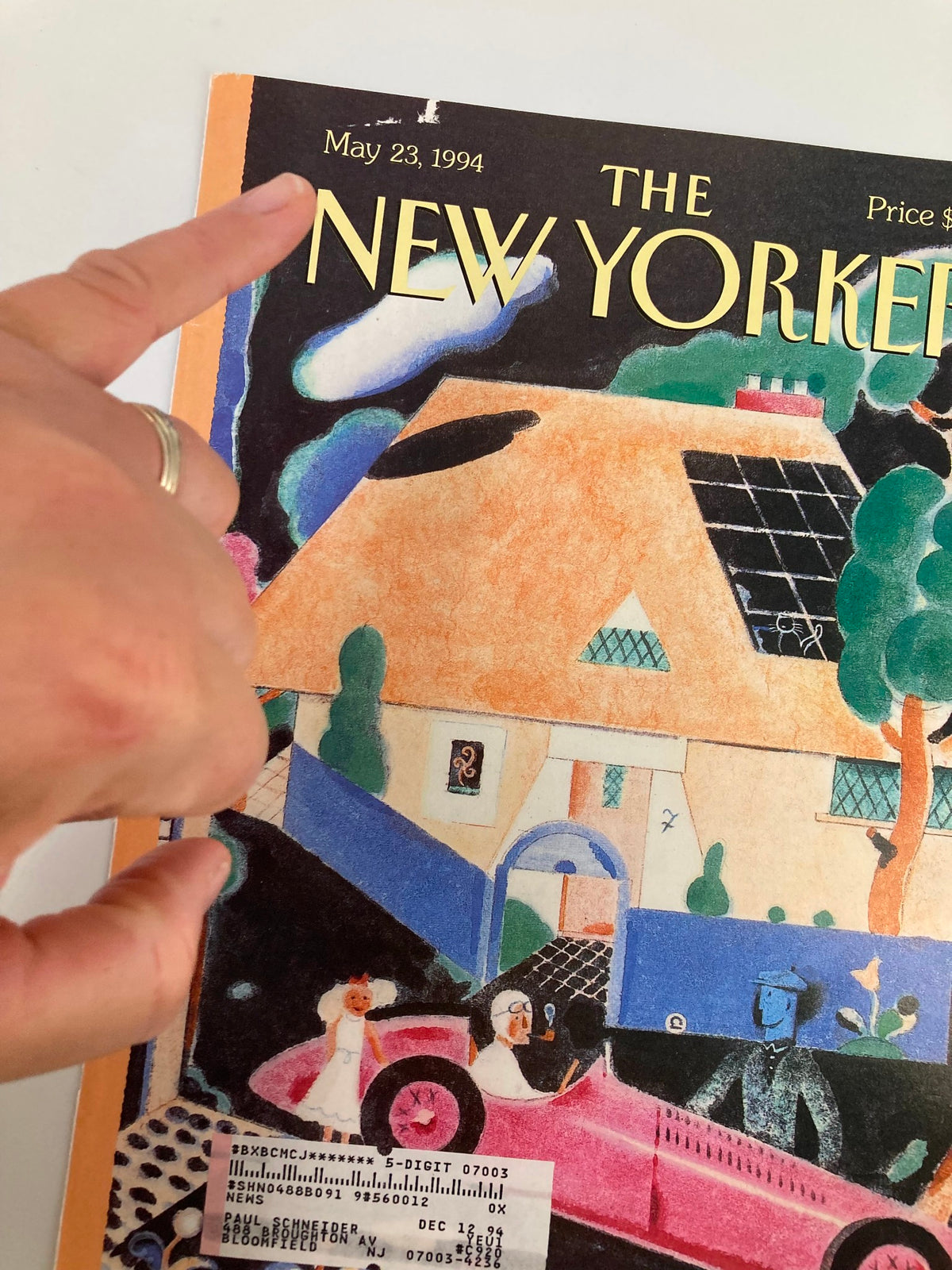 Close-up view of The New Yorker magazine cover dated May 23, 1994, featuring the artwork 'A Spin in the Country' by Ever Muelen, with a focus on the date and title.