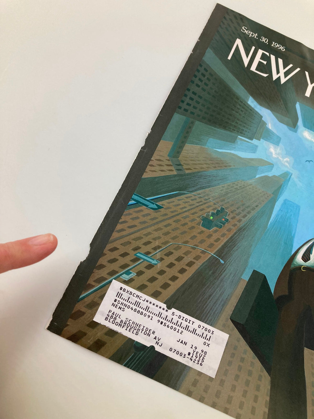 Close-up detail of The New Yorker September 30 1996 cover 'Looking Up' by Eric Drooker, highlighting the side of the magazine with a price tag and graphic elements.
