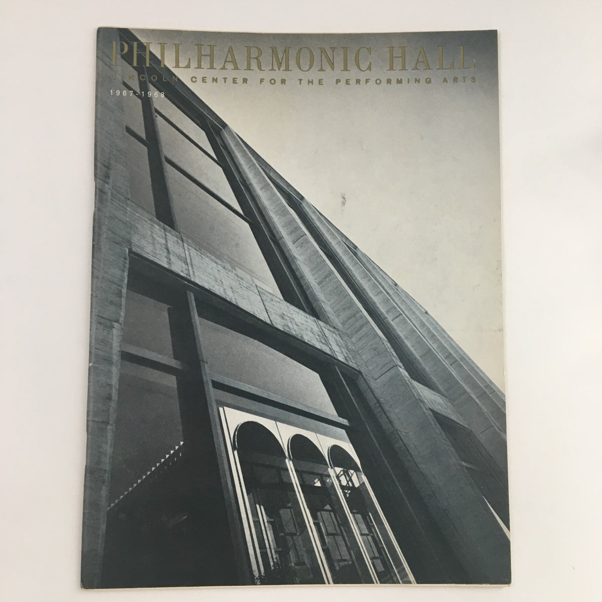 Cover of the 1967 Philharmonic Hall Lincoln Center Present The Master Virtuosi of New York, showcasing the iconic architecture of the venue in a striking black and white photograph.