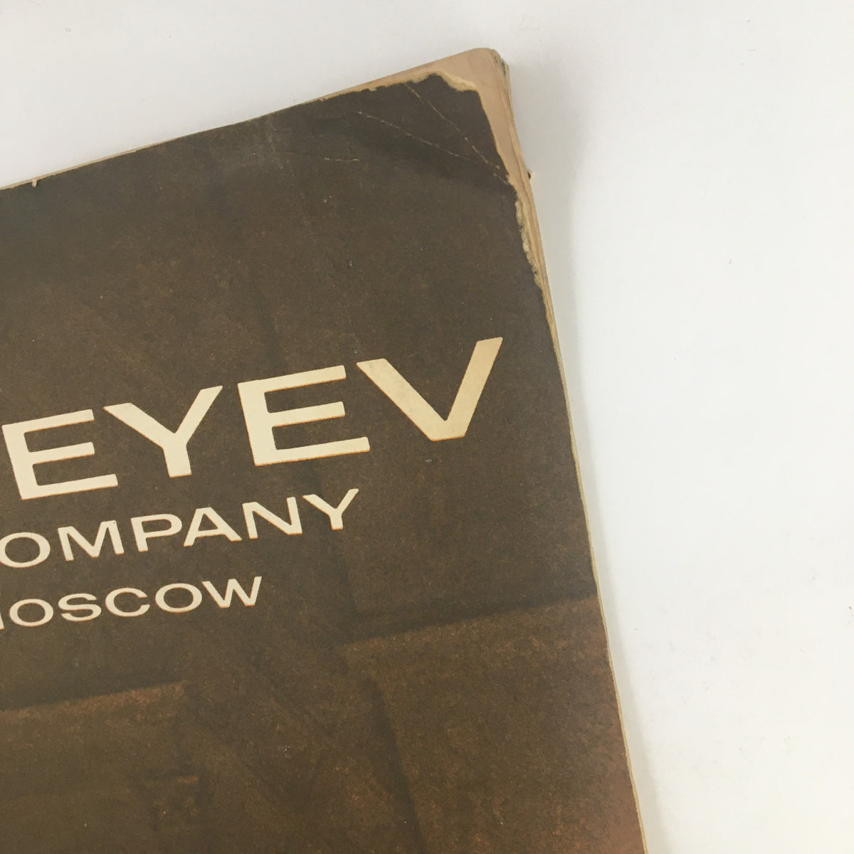 Cover of 1965 S. Hurok Presents Moiseyev Dance Company from Moscow by Igor Moiseyev showing wear and tear with notable damages.