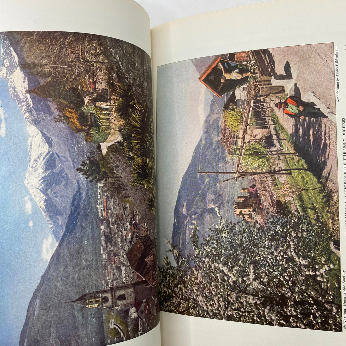 Interior page of National Geographic Magazine April 1928 displaying a scenic view of a mountainous landscape, highlighting the beauty of nature as featured in 'A Walking Tour Across Iceland'.