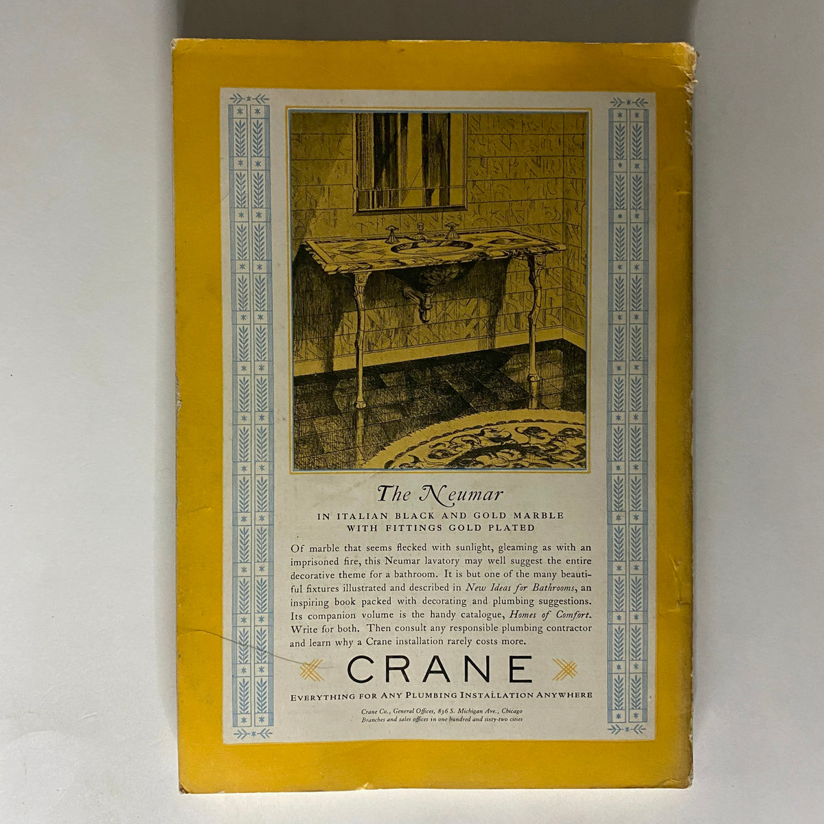 The Neumar by Crane, an elegant piece in Italian black and gold marble with gold plating, featured on the back cover of National Geographic Magazine April 1928.