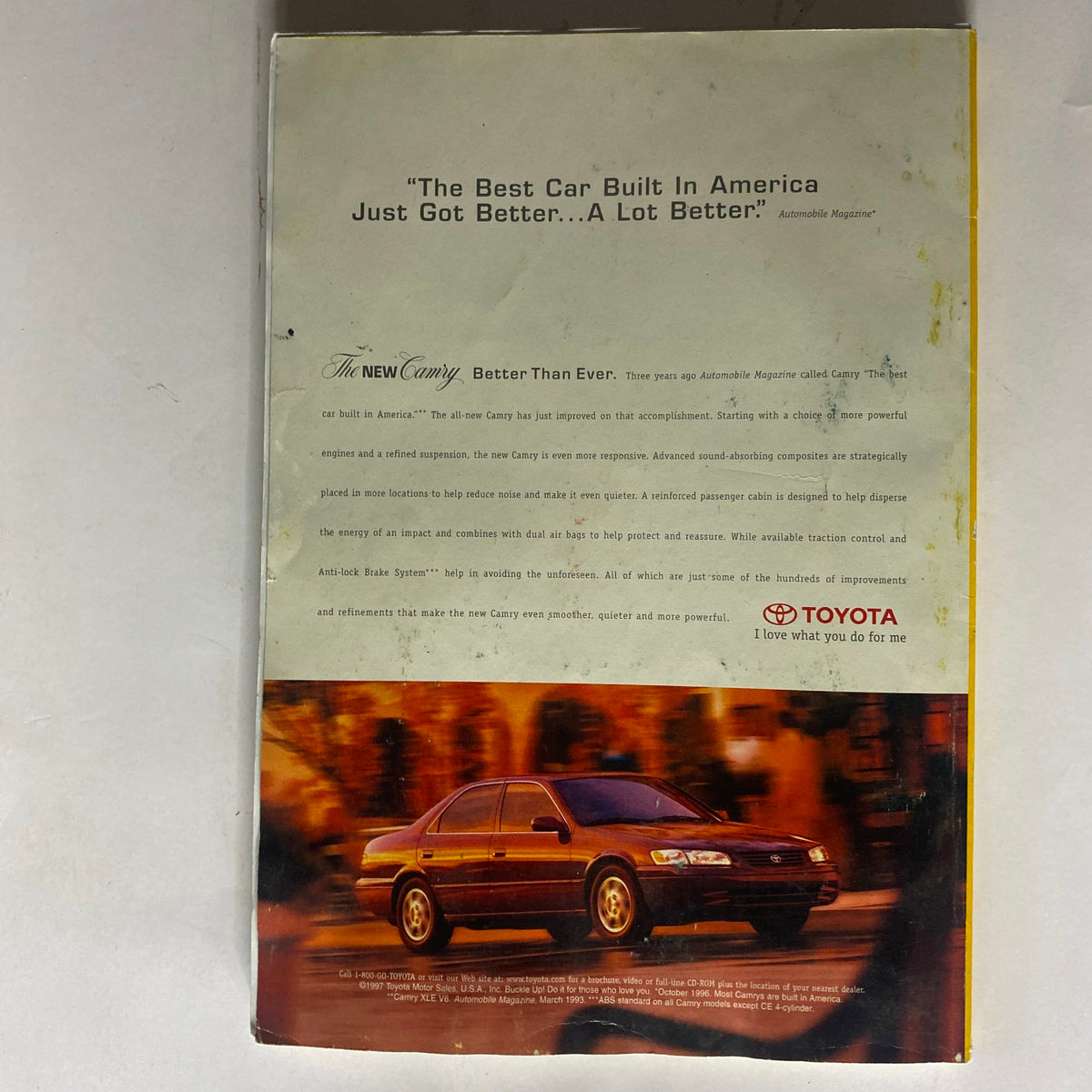Back cover of National Geographic Magazine May 1997 featuring an advertisement for the new Toyota Camry, highlighting features such as noise reduction and safety enhancements, with a sleek image of the Camry.