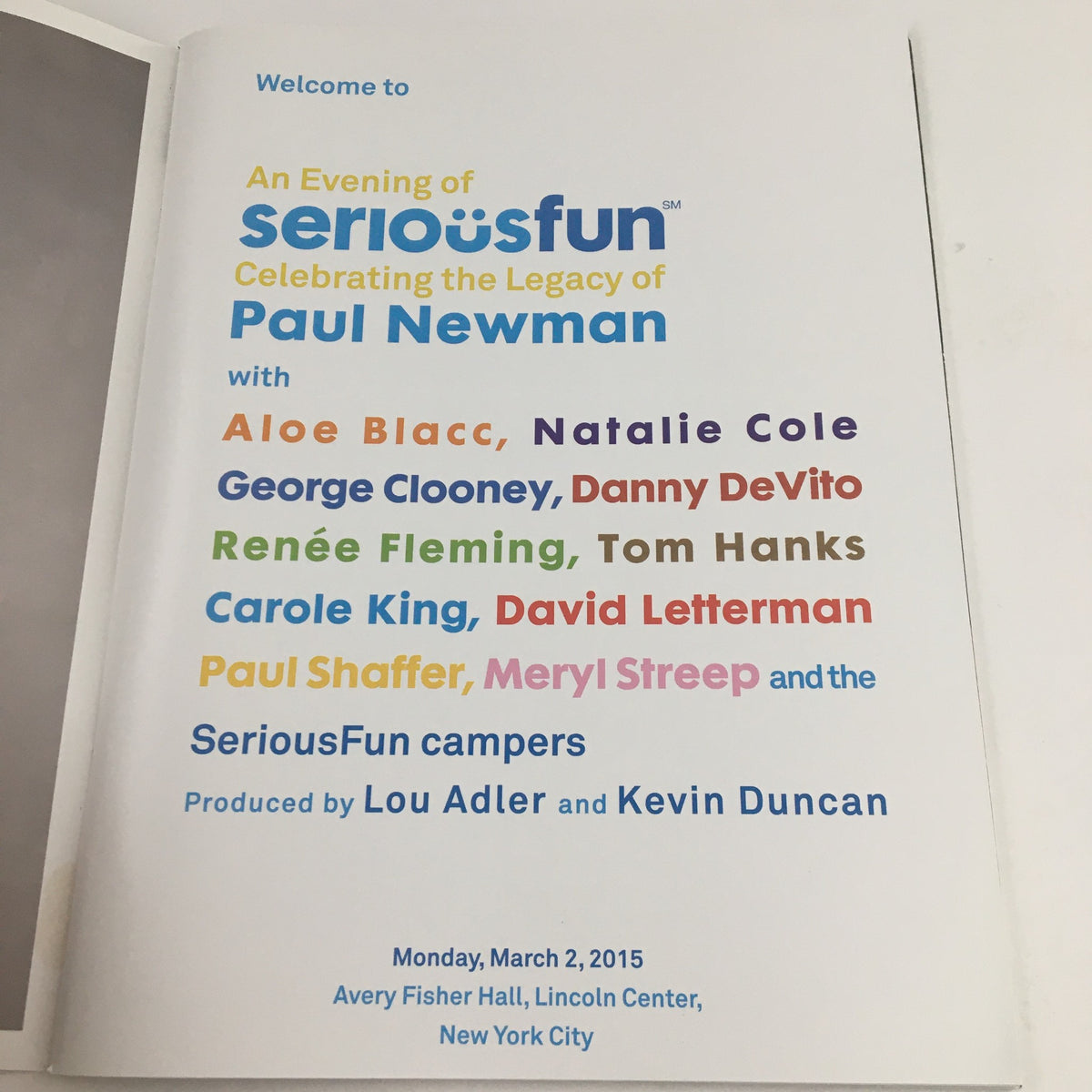 Inside page of the program for 'An Evening of Serious Fun Celebrating the Legacy of Paul Newman', listing notable attendees including George Clooney, Meryl Streep, and others, held at Avery Fisher Hall, Lincoln Center.