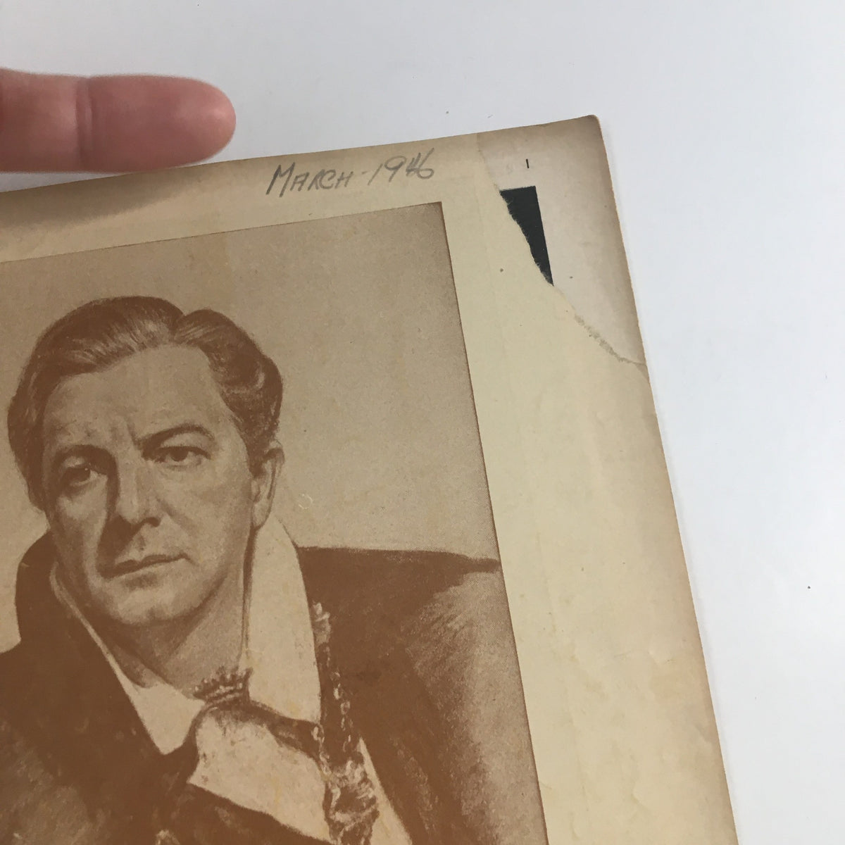 Close-up of the March 1946 Playbill for Columbus Circle Theatre, showcasing Maurice Evans' Hamlet with focus on the actor's illustration.