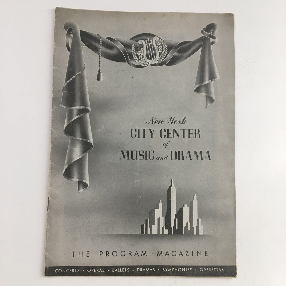 1945 New York City Center of Music and Drama presentation program for The Bartered Bride opera. Vintage design featuring elegant decorations and the skyline of New York.
