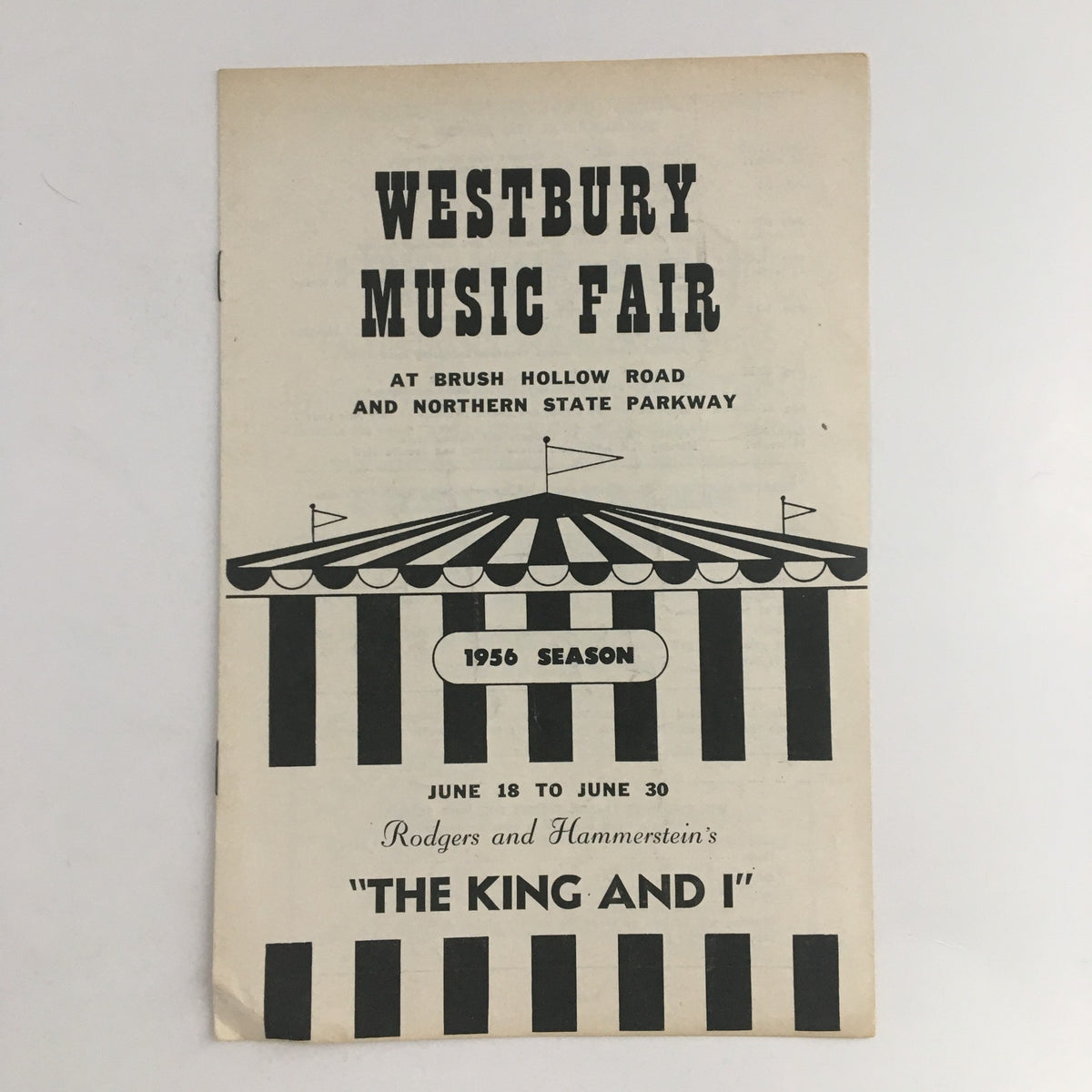 Front cover of the 1956 season program for Westbury Music Fair featuring Rodgers & Hammerstein's The King and I, showcasing the event details and iconic striped tent design.