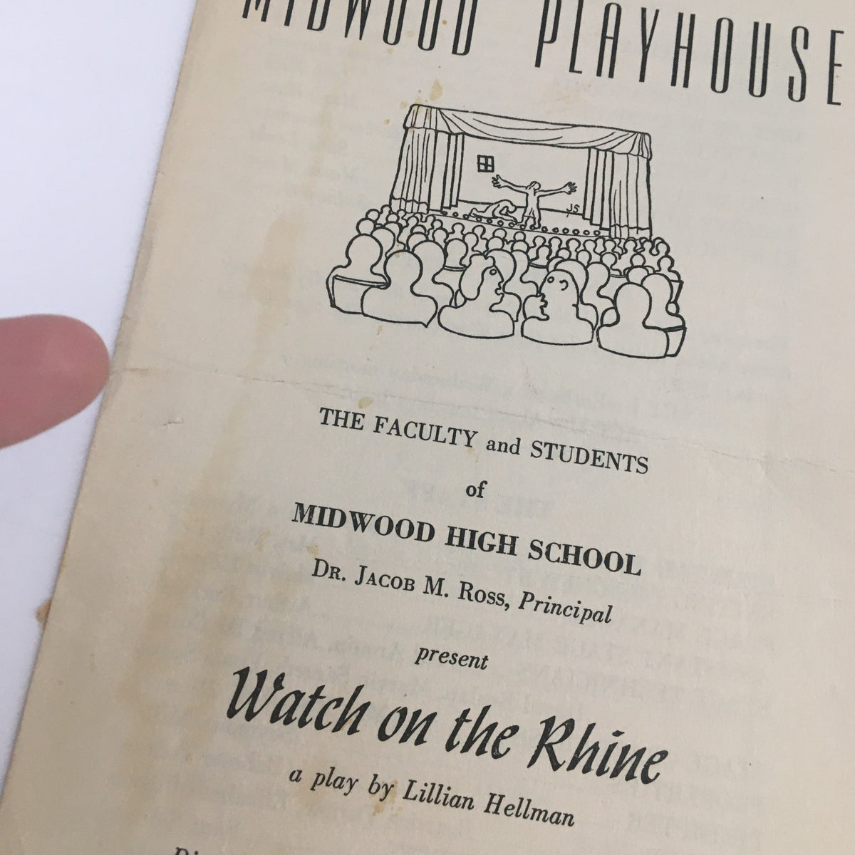 Close-up of the 1942 Midwood Playhouse program for 'Watch on the Rhine', a play by Lillian Hellman, showing details of the production and cast.