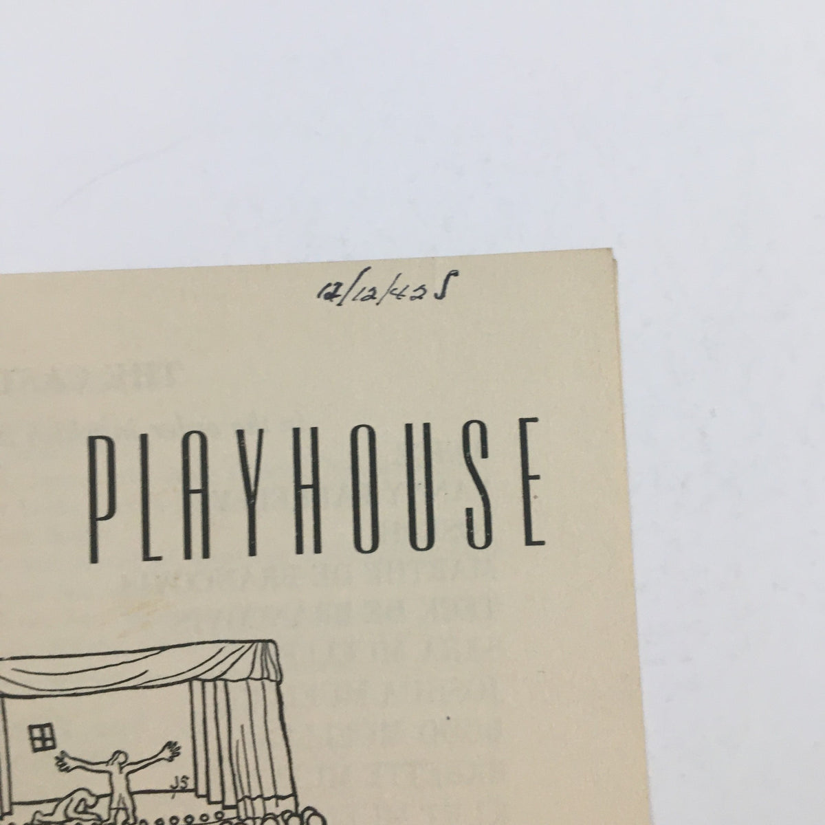 Close-up view of the 1942 Midwood Playhouse production of 'Watch on the Rhine' featuring handwritten date, highlighting its historical significance.