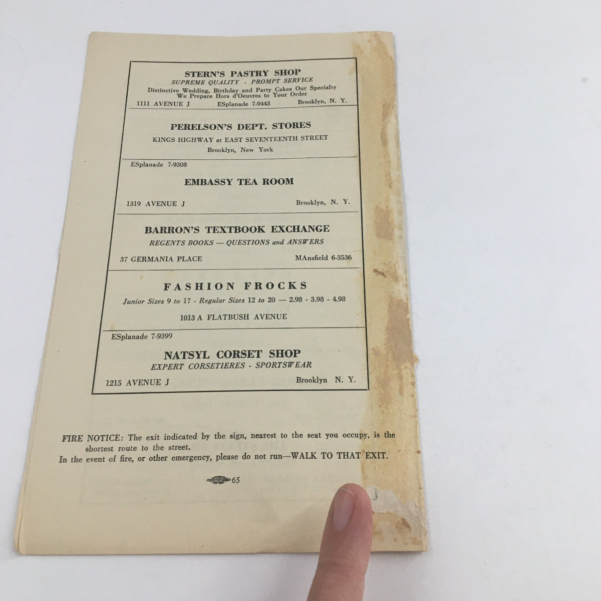 Back cover of the 1942 Midwood Playhouse 'Watch on the Rhine' program, displaying advertisements and details on local businesses.