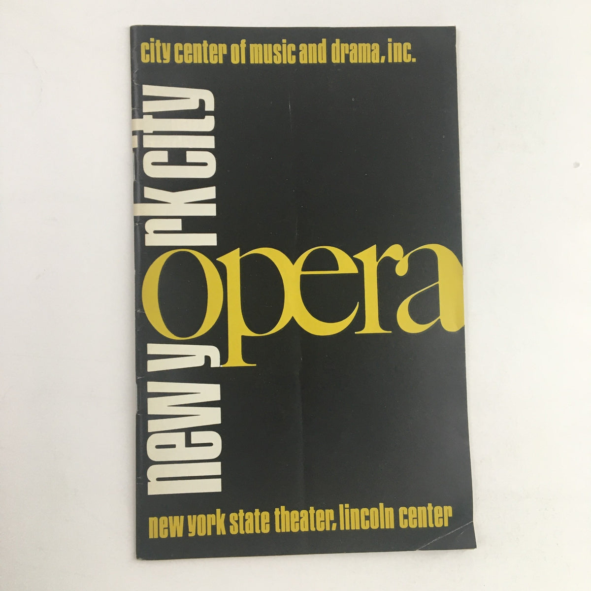 Cover of a 1973 program for the New York State Theater at Lincoln Center presenting 'Silent Patron of the Arts', featuring bold typography with the words 'new york city opera'.