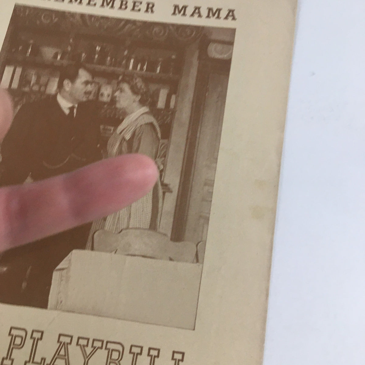 Close-up of the 1945 Playbill for I Remember Mama showing two characters, highlighting the vintage design and details.