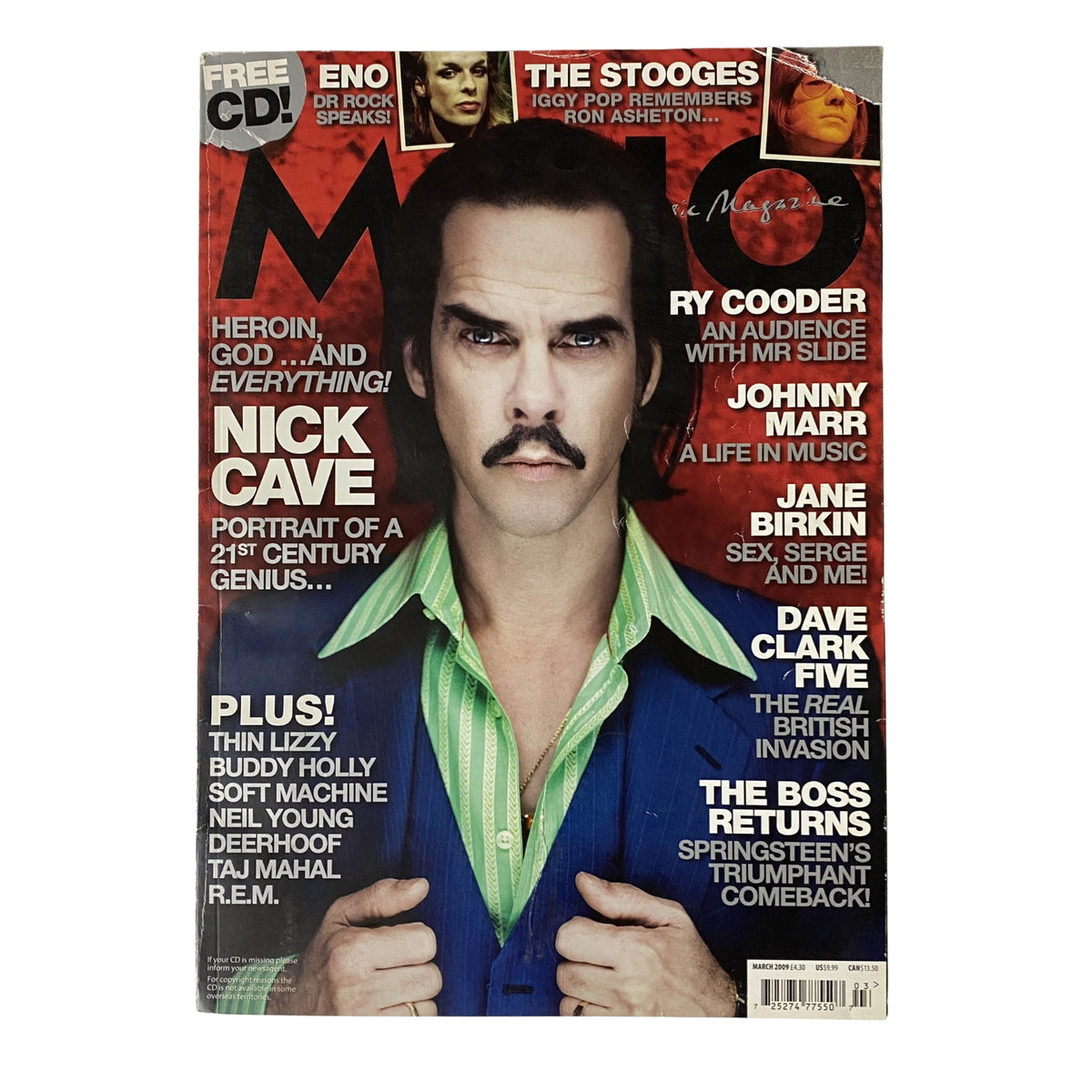 Mojo Music Magazine March 2009 featuring Nick Cave on the cover, showcasing a stylish portrait of the musician with a mustache and a colorful shirt. No CD included. Good condition with plastic protective cover.