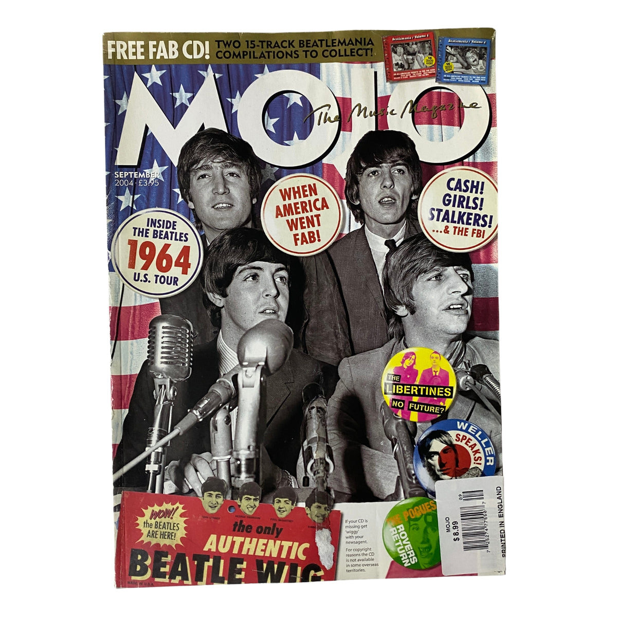 Mojo Music Magazine September 2004 featuring The Beatles on the cover, showcasing four band members at a press conference with a vintage feel.