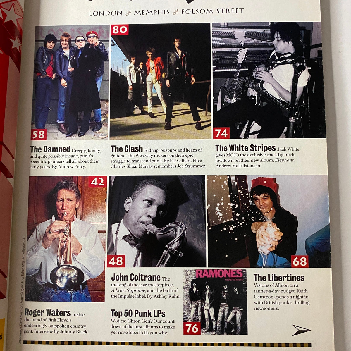 Inside page of Mojo Music Magazine from March 2003, showcasing The Clash alongside notable punk artists and bands, including The Damned, Roger Waters, and The Ramones.