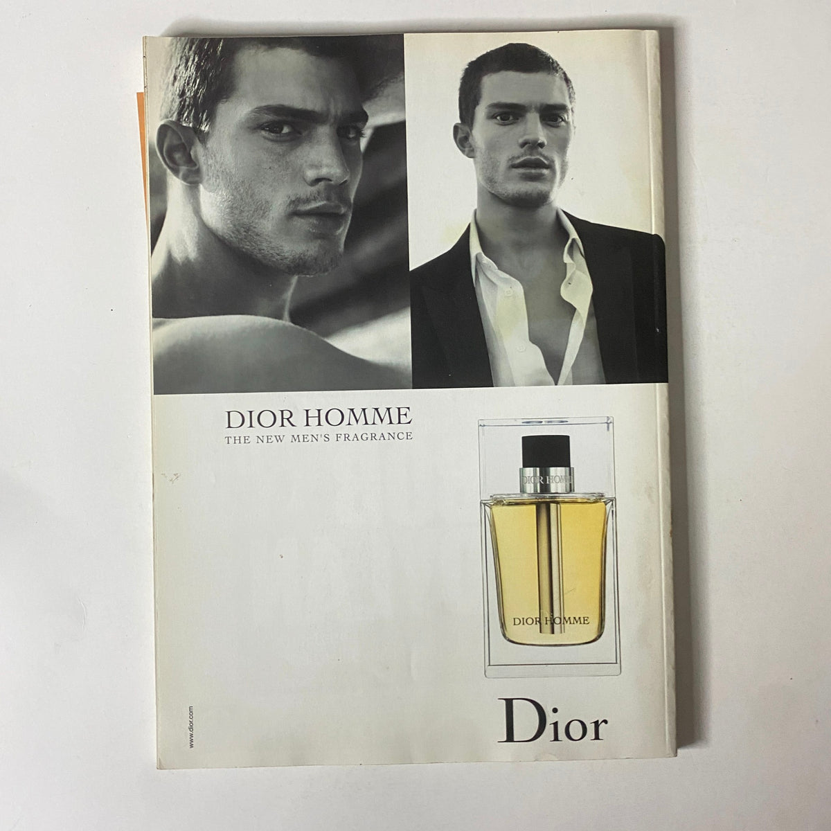 Advertisement in Mojo Music Magazine April 2006 for Dior Homme, featuring models and fragrance details.