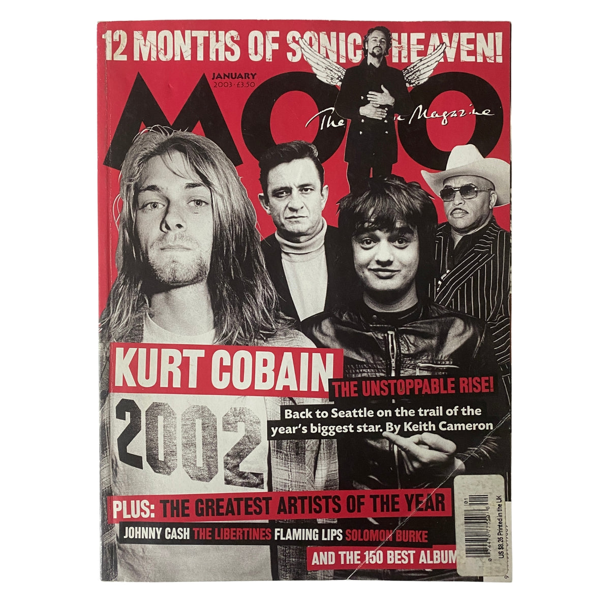 Mojo Music Magazine January 2003 featuring Kurt Cobain on the cover, highlighting various articles related to music, including a feature on Kurt's legacy in 2002.