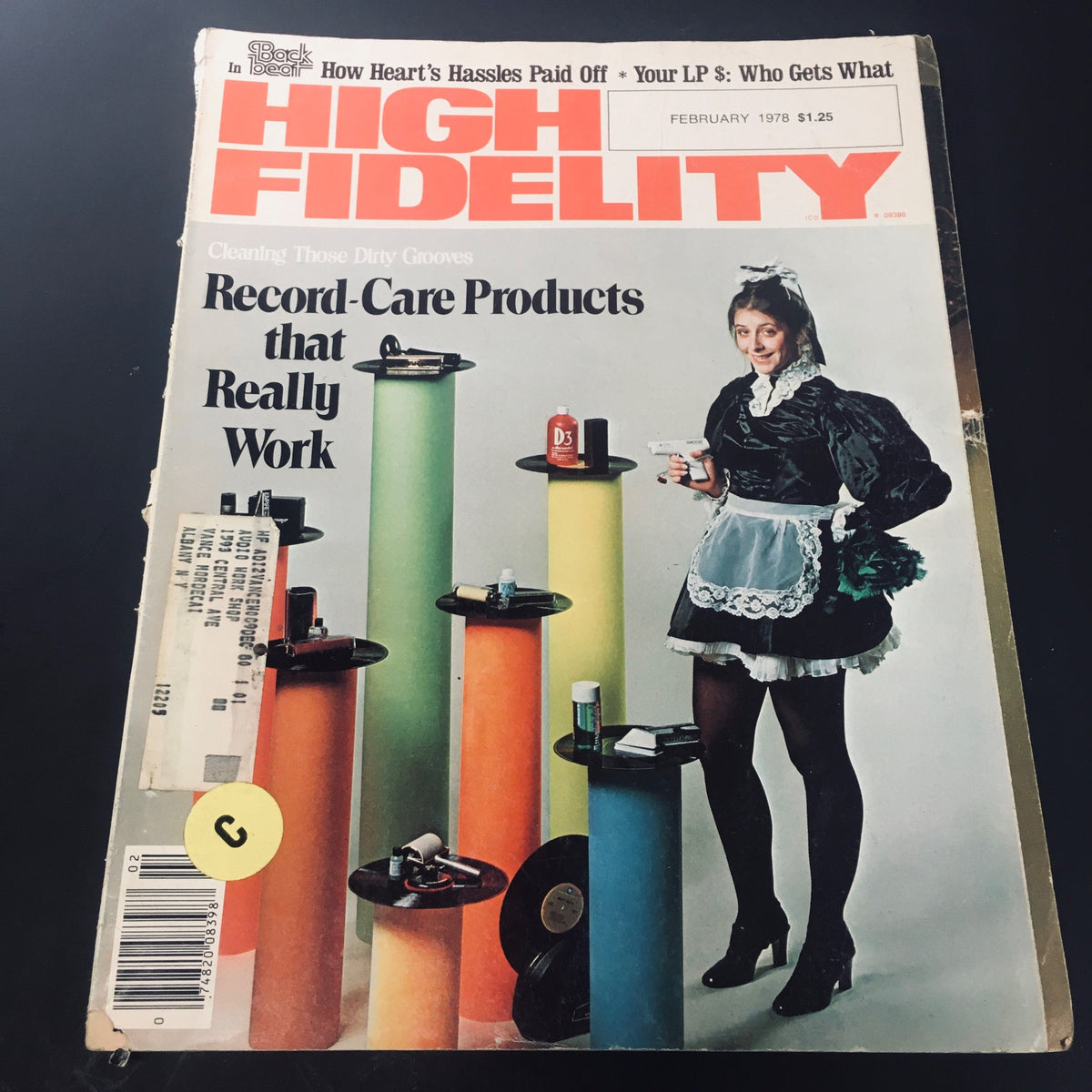 High Fidelity Magazine February 1978 cover featuring the title 'How Heart's Hassle Paid Off', showcasing a woman in vintage attire holding cleaning products with vibrant colored columns in the background.