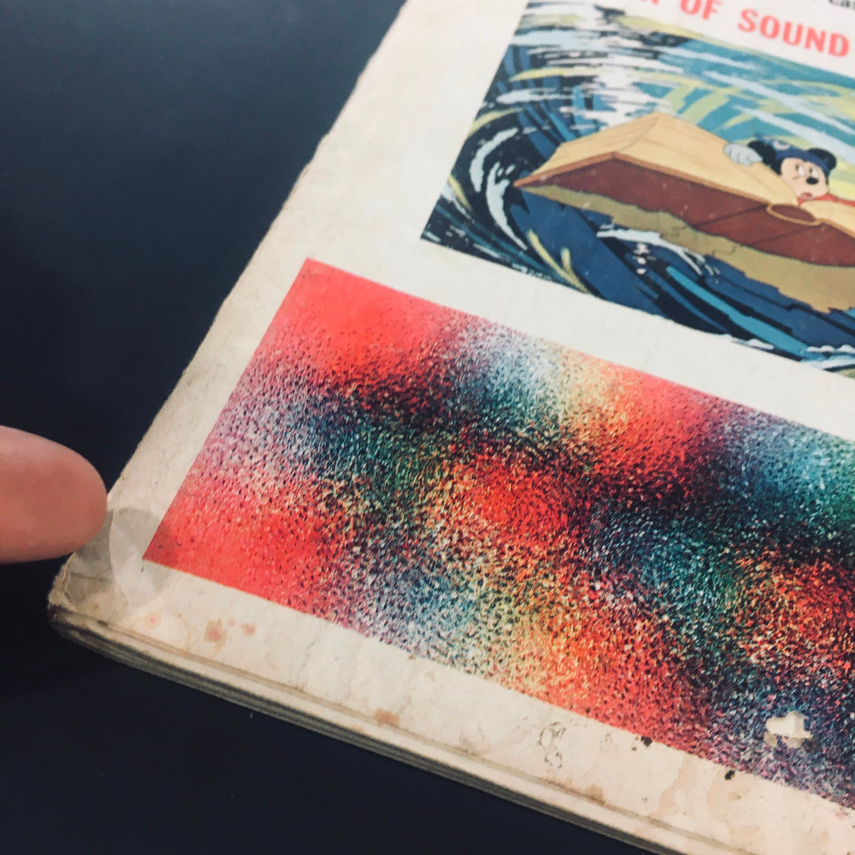 Side view of the back cover of VTG High Fidelity Magazine March 1971, highlighting colorful graphics and wear on the binding, indicative of its vintage condition.
