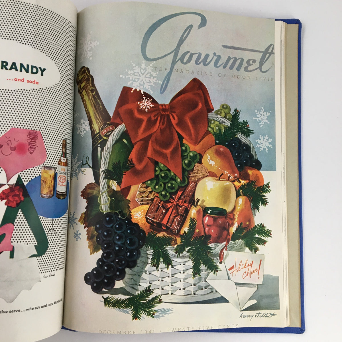 Cover of Gourmet: The Magazine of Good Living Vol 4 (January to December 1944), featuring a festive illustration of a basket filled with holiday fruits and a red ribbon. Ideal for collectors of vintage culinary literature.