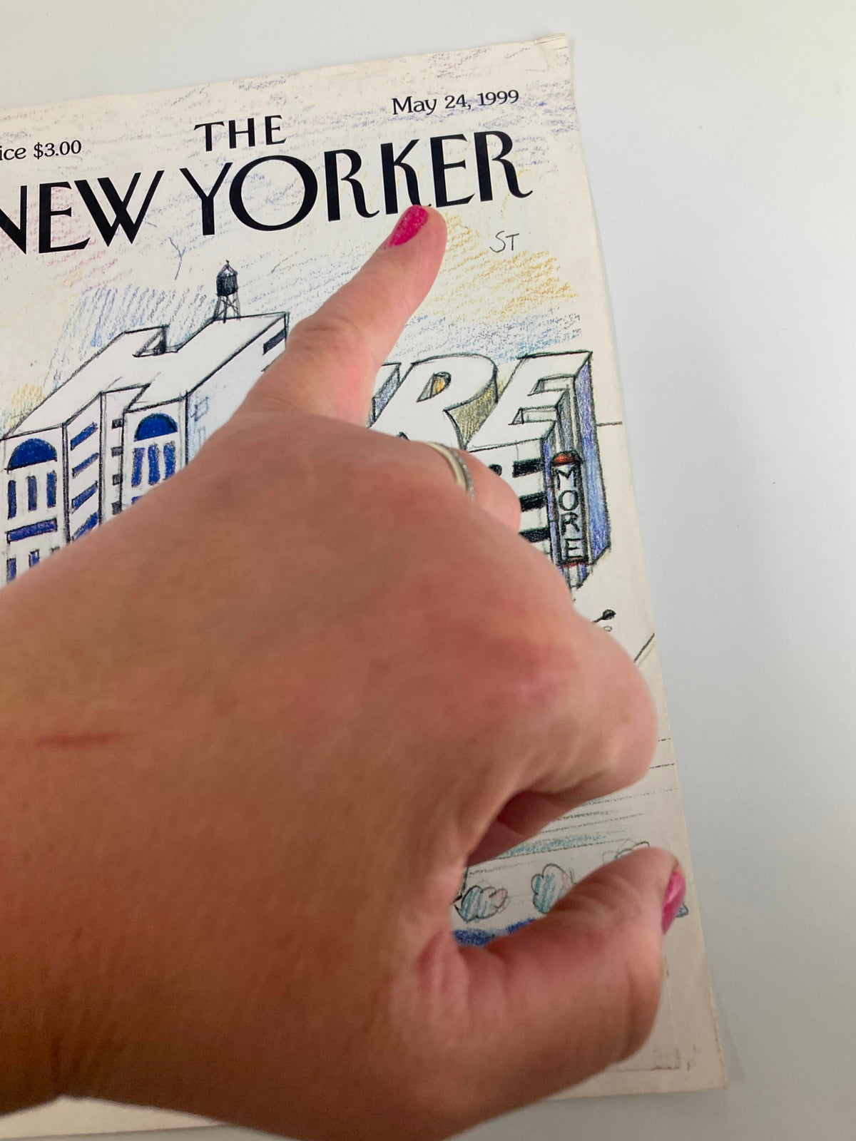 Close-up of the cover of The New Yorker, May 24, 1999, titled 'Here Now' by Saul Steinberg, highlighting the title and date with a hand pointing at the artwork.