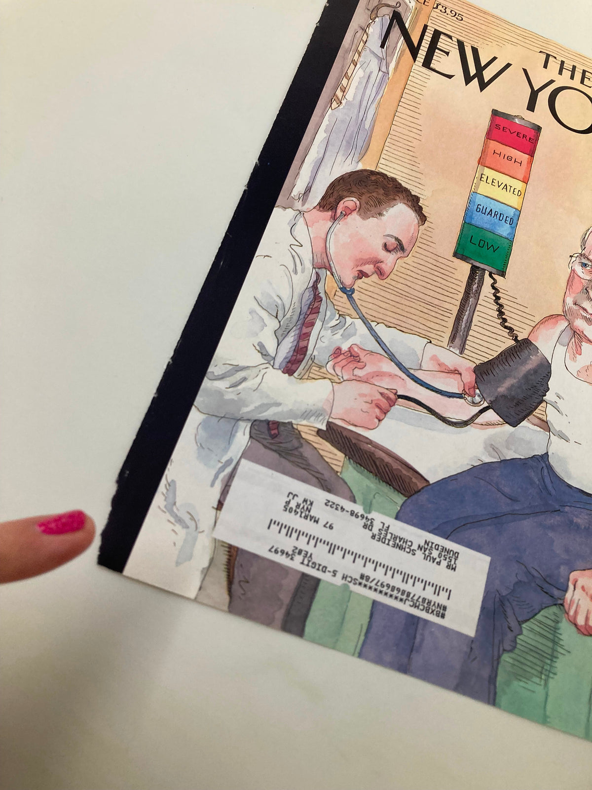 Close-up view of The New Yorker cover, August 30, 2004, titled 'At Risk?' by Barry Blitt, showing a doctor checking a patient's blood pressure with attention to detail on the artwork.