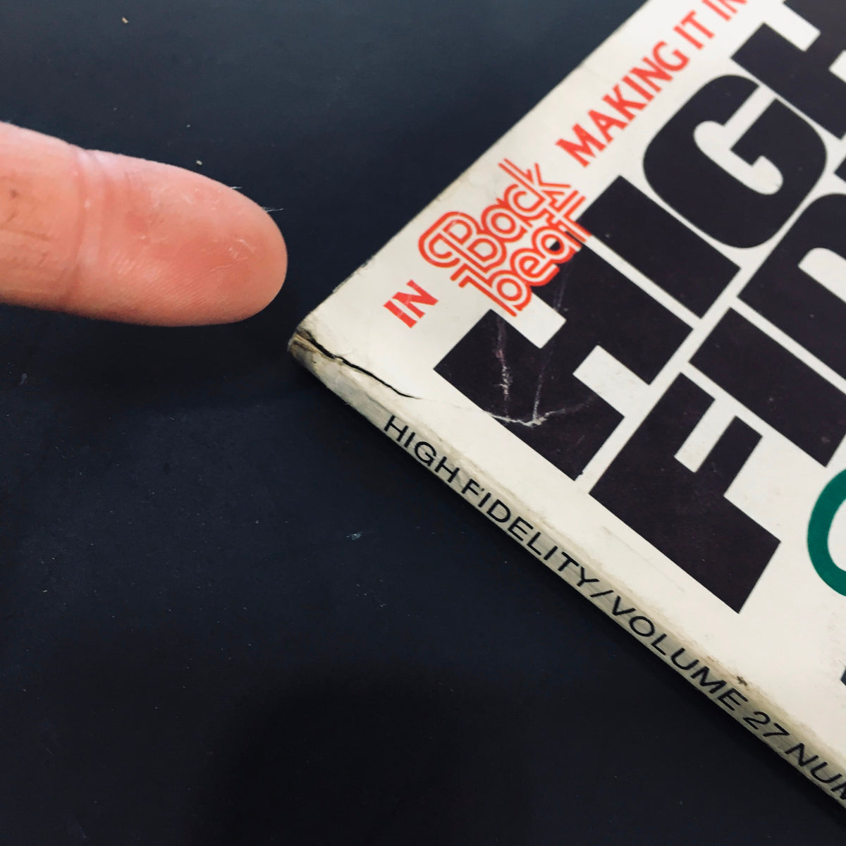 Side view of VTG High Fidelity Magazine June 1977 displaying slight wear and tear on the spine, emphasizing its vintage character.