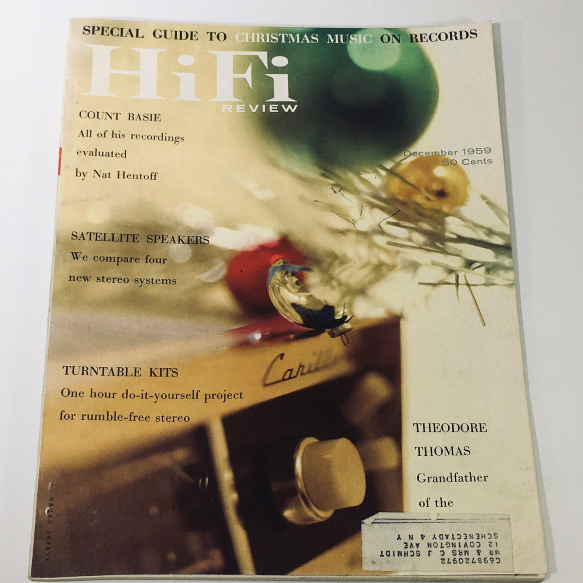 Cover of the VTG HiFi Review Magazine December 1959 featuring Theodore Thomas and Satellite Speakers. The design showcases a festive theme with Christmas ornaments, highlighting features on Count Basie, satellite speakers, and turntable kits. A historical glimpse into late 1950s audio culture.