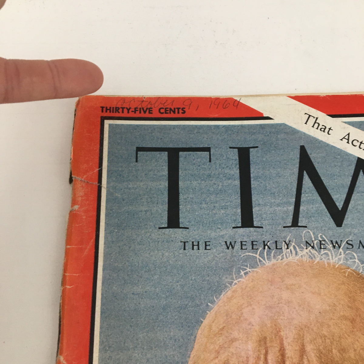 Close-up of Time Magazine dated October 9, 1964, with the title prominently displayed, featuring a handwritten date and pricing.