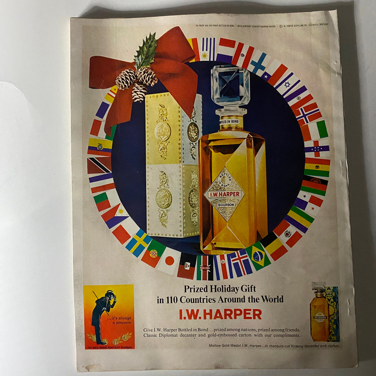Advertisement page from VTG Esquire Magazine January 1967 showcasing I.W. Harper Bourbon, featuring festive holiday imagery and a decorative border with flags.