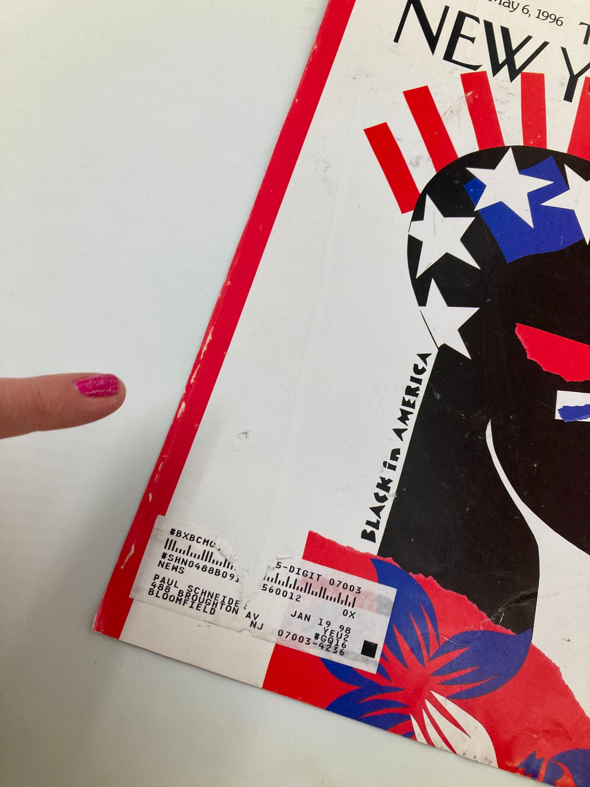Detailed view of The New Yorker cover dated April 29, 1996, titled 'Black in America' by Michael Roberts, showcasing signs of wear and an address label.