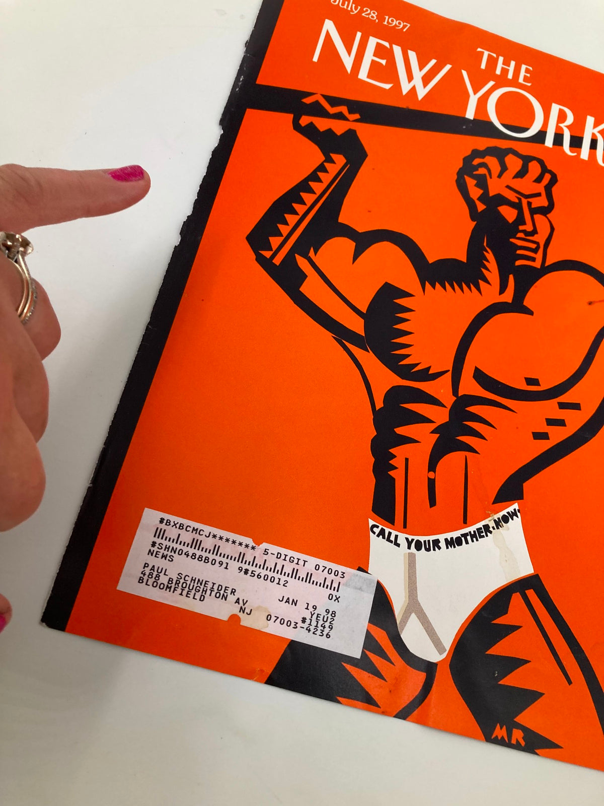 The New Yorker cover July 28, 1997 titled 'Below the Belt' by Michael Roberts featuring a bold graphic of a muscular man against an orange background, highlighting artistic details and vintage charm.