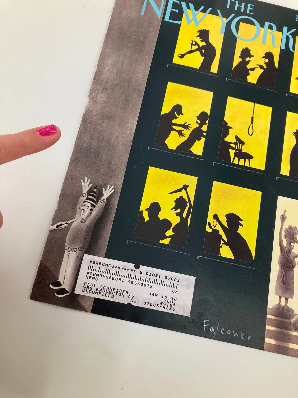 Close-up view of the cover of The New Yorker, January 20, 1997, showing details of the 'Disturbing the Peace' artwork by Ian Falconer and a hand pointing to the cover.