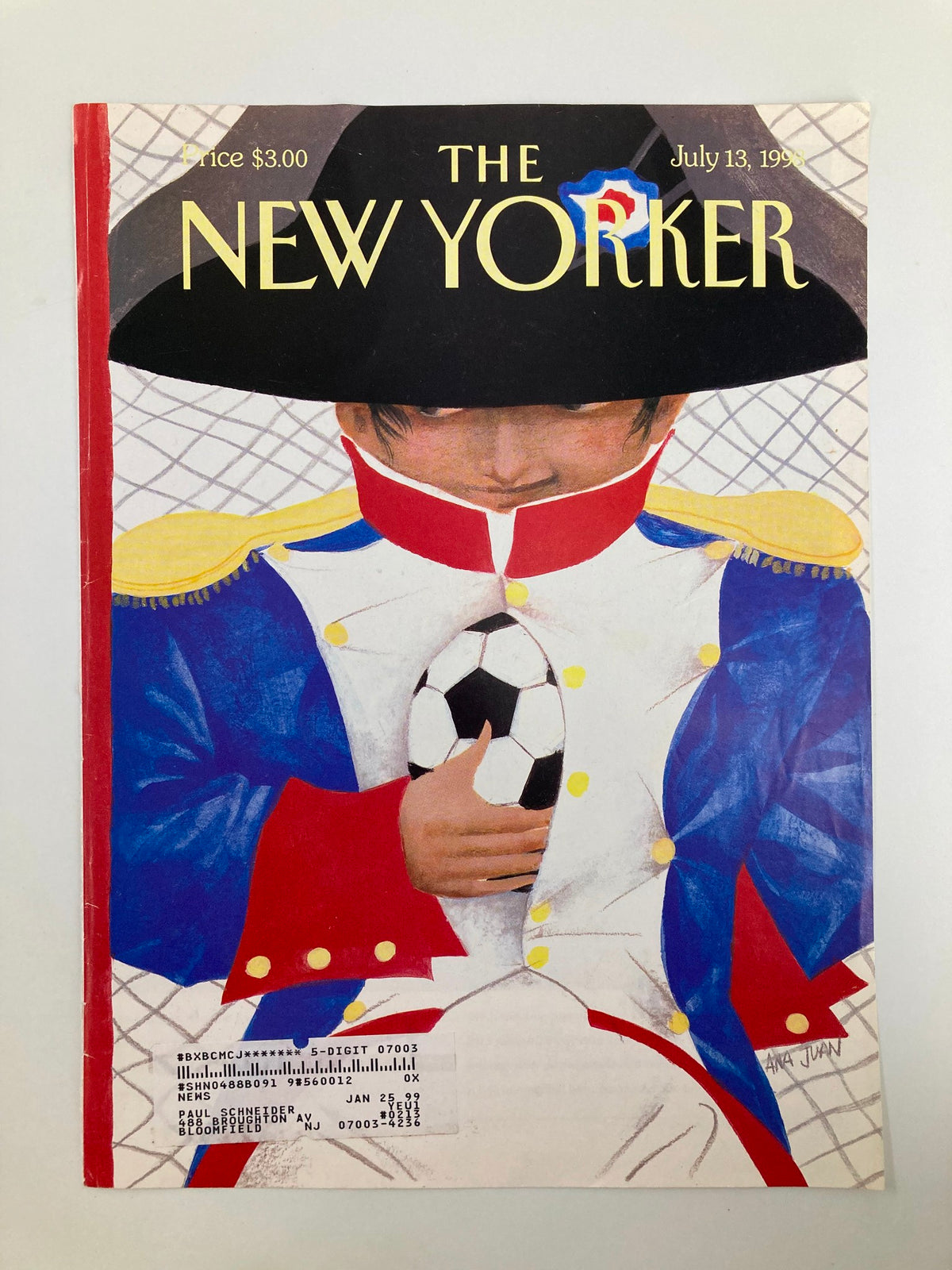 Cover of The New Yorker, July 13, 1998 by Ana Juan. The magazine cover depicts a child dressed in a historical military uniform, grasping a soccer ball, symbolizing the blend of history and modern sports.