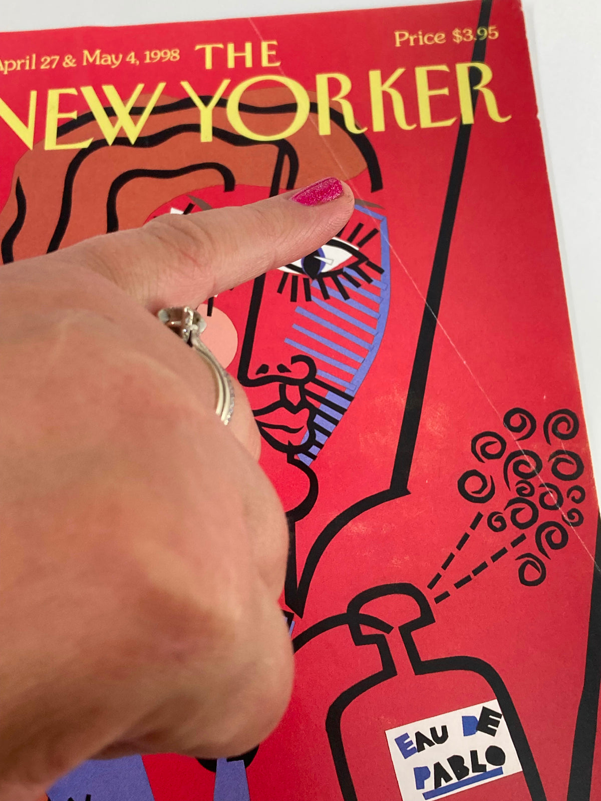 COVER ONLY The New Yorker April 27 1998 Eau de Pablo by Michael Roberts, displaying a close-up of the magazine's cover art, focusing on the woman's eye and the perfume bottle, with colorful patterns and a striking aesthetic.