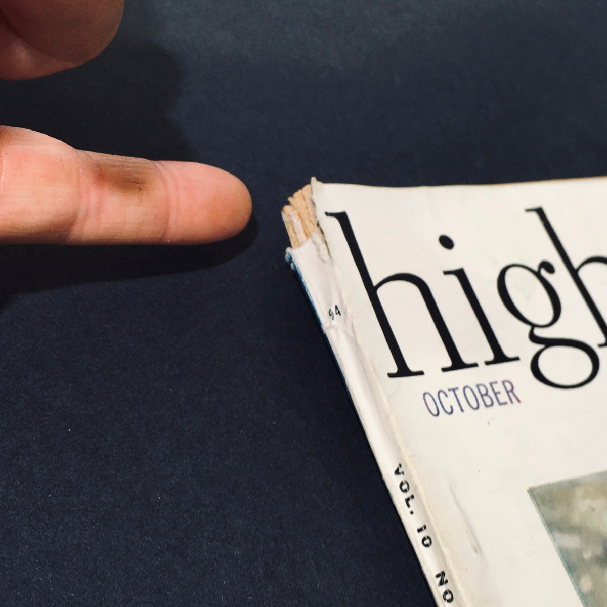 Close-up of the corner of the VTG High Fidelity Magazine October 1960 showing wear and damage, indicating its vintage condition.