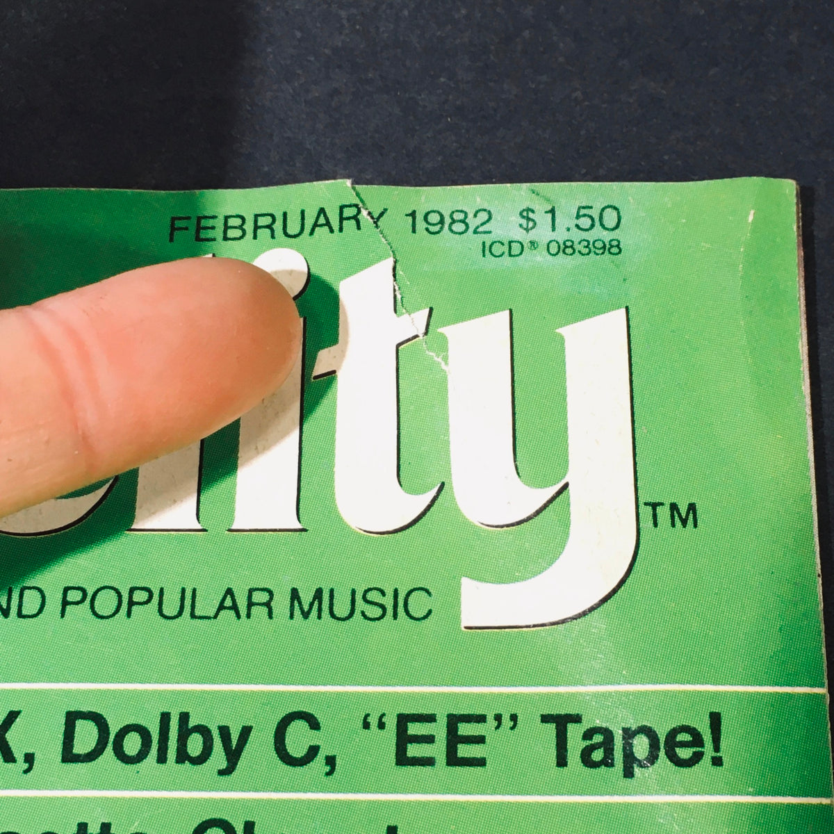 Close-up of the top edge of High Fidelity Magazine February 1982 showing a tear and the date on the cover.