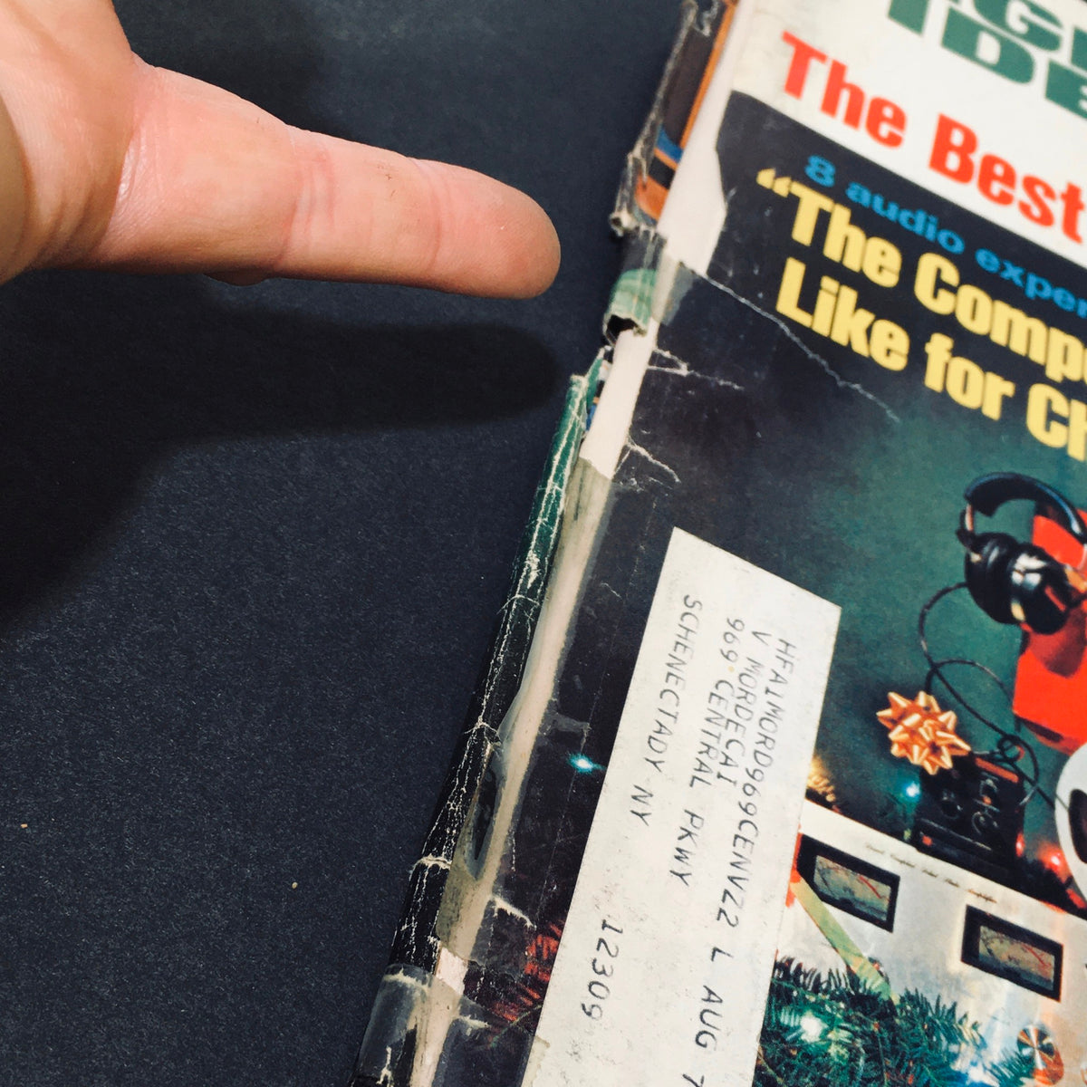 Side view of the VTG High Fidelity Magazine December 1972 with wear, including an address label, emphasizing its vintage character.