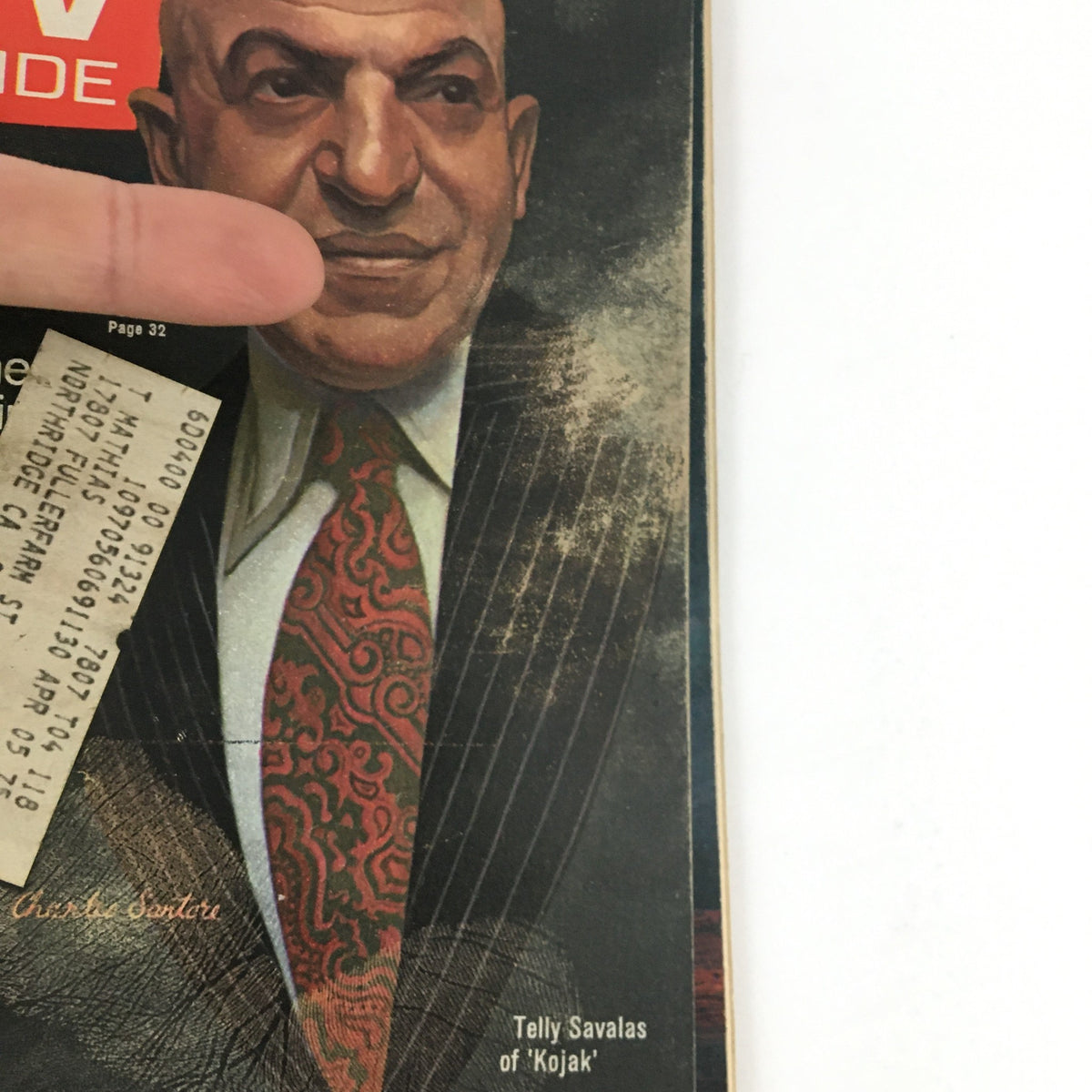 Close-up view of the August 31, 1974 TV Guide Magazine cover featuring Telly Savalas from 'Kojak', highlighting details of Savalas's attire and facial expression.
