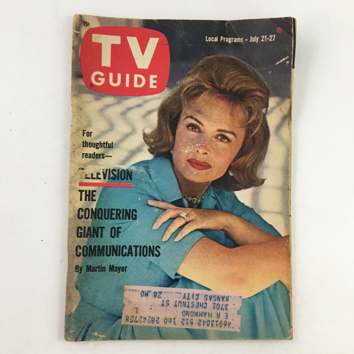Cover of TV Guide Magazine July 21, 1962, featuring the article 'The Conquering Giant of Communication' with a woman in a blue outfit and vintage hairstyle.