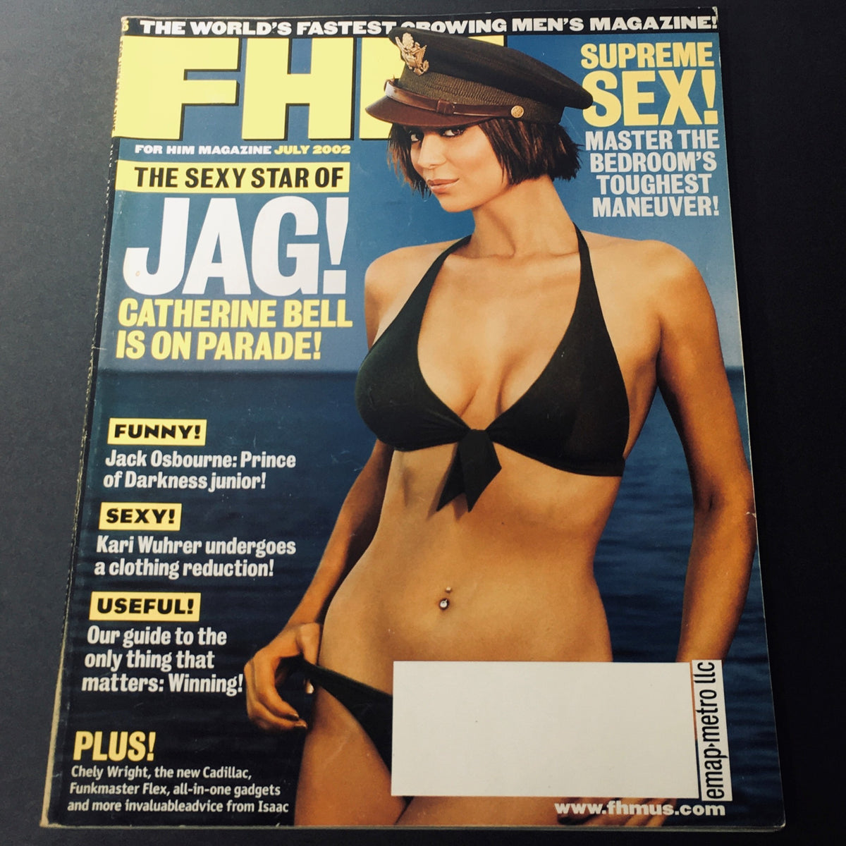 FHM Magazine July 2002 cover featuring Catherine Bell in a bikini, showcasing her role as the sexy star of JAG. The magazine includes highlights about Jack Osbourne and other engaging content, making it a collectible issue from the early 2000s.