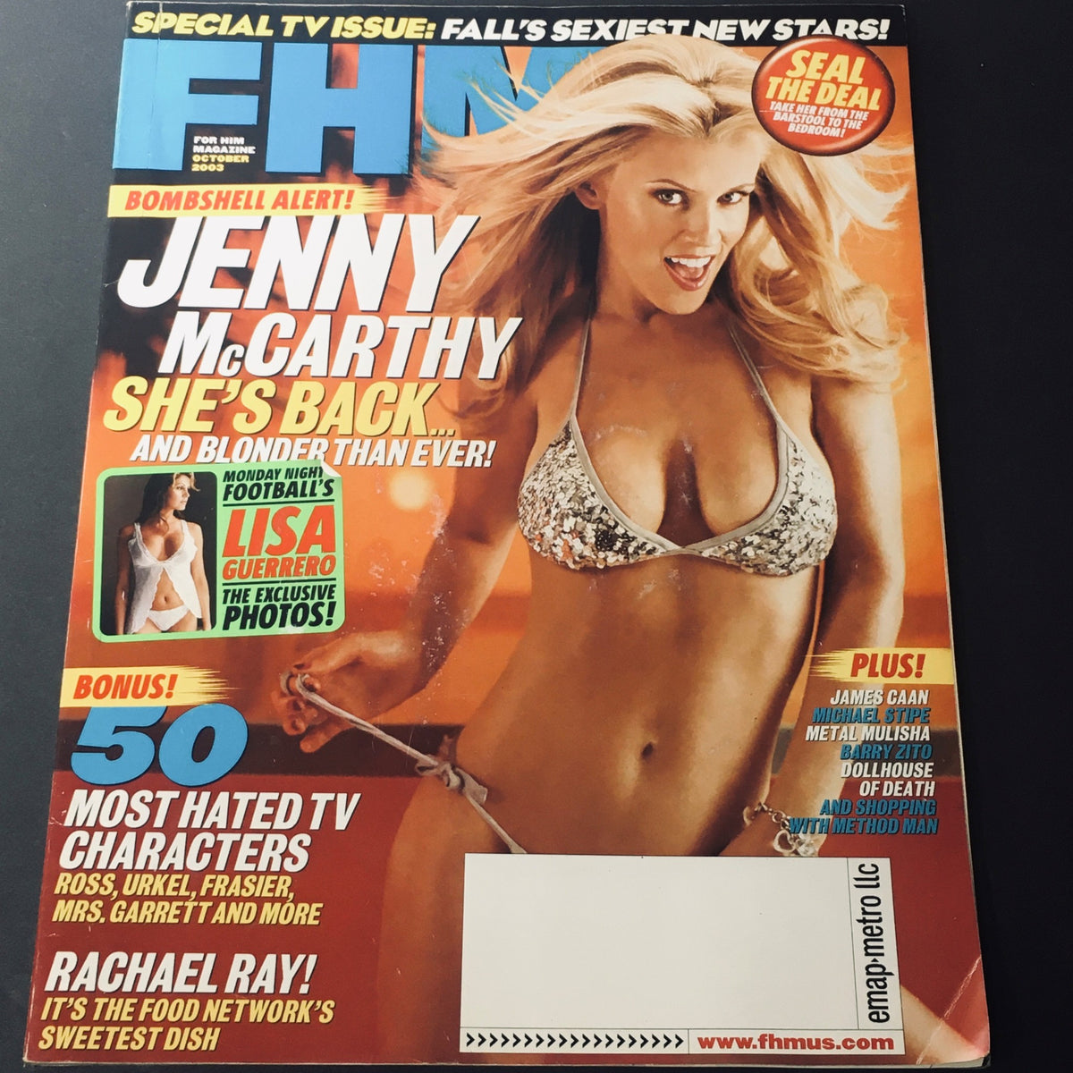 FHM Magazine October 2003 featuring Jenny McCarthy on the cover in a bikini, showcasing her return and an exclusive with Lisa Guerrero. The magazine includes highlights of the 50 most hated TV characters and is presented in good, used condition with minor wear.