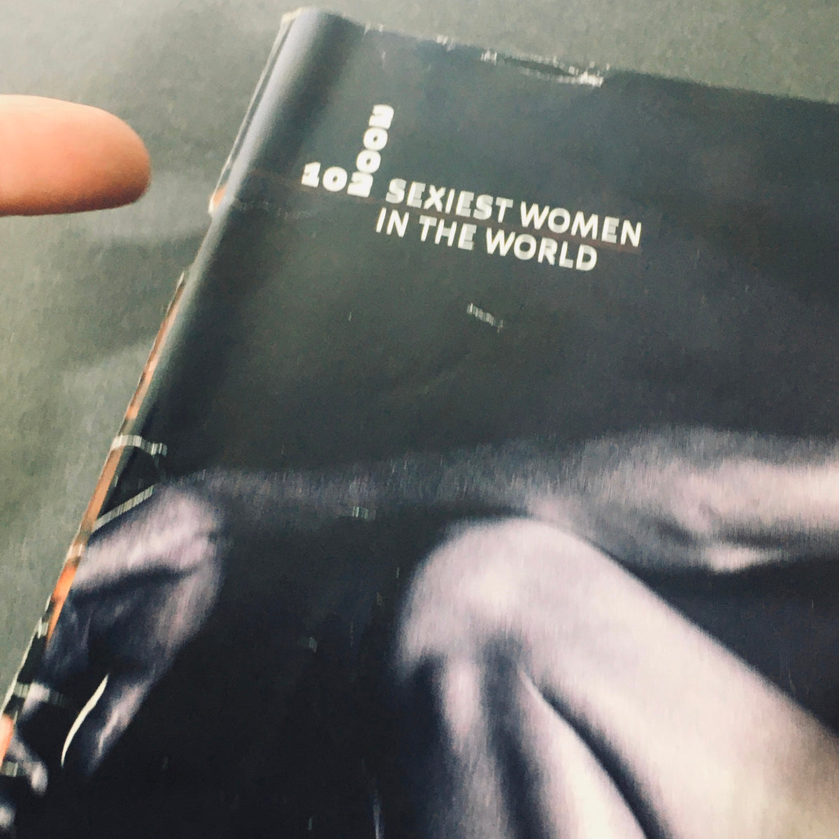 Close-up of the top corner of Stuff For Men Magazine October 2002 displaying the title 'Sexiest Women In The World'.