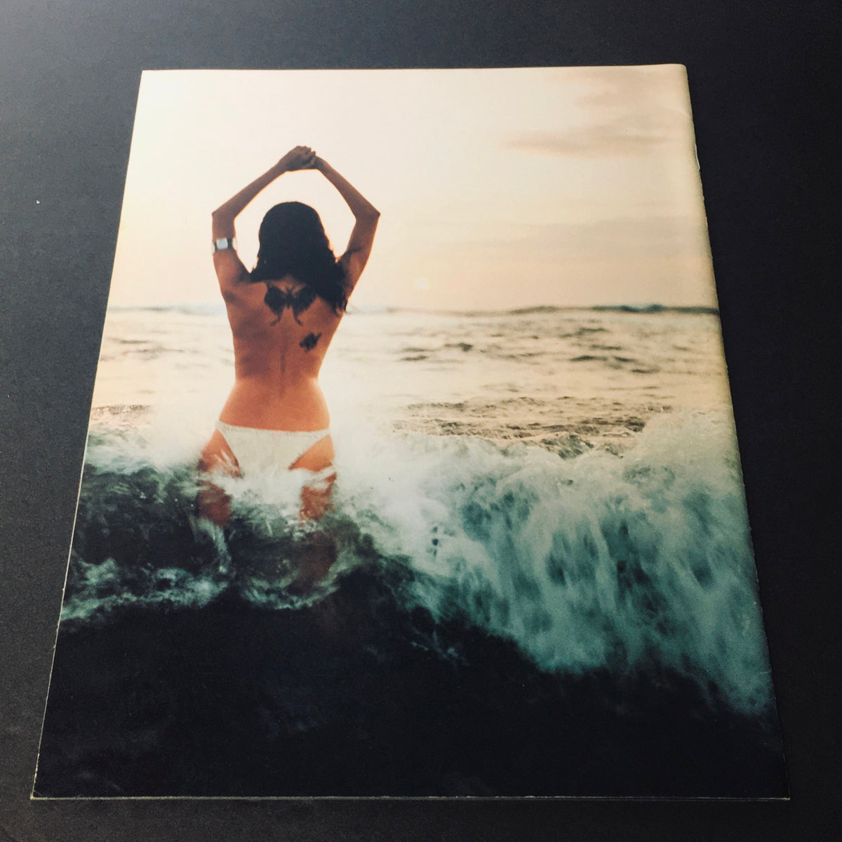 Cover image of Stuff For Him Magazine 2000, depicting a woman standing in the ocean with her back to the camera, highlighting the magazine's theme of beauty and allure as featured in the iconic edition highlighting the 100 Sexiest Women In The World.