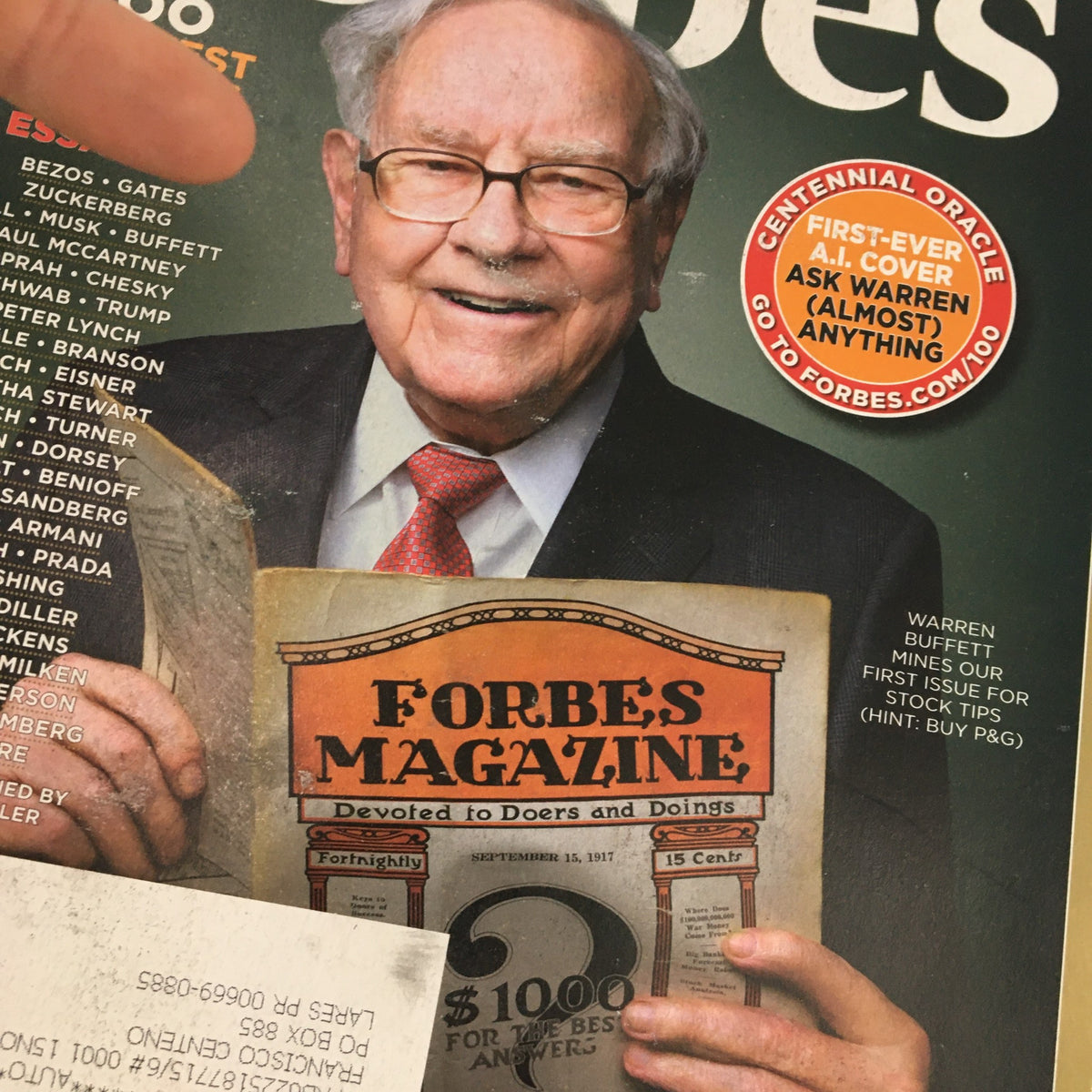 Close-up of Forbes Magazine September 28 2017 featuring Warren Buffet holding a vintage issue with the title 'Forbes Magazine' and stock tips.