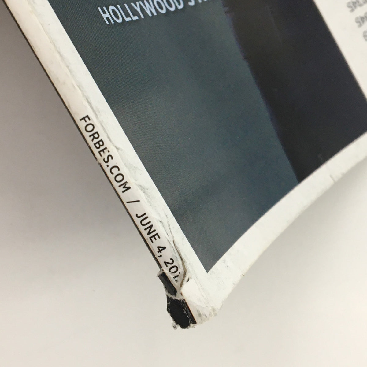 Side view of the June 4, 2012 Forbes Magazine, highlighting wear on the binding, part of its vintage appeal.