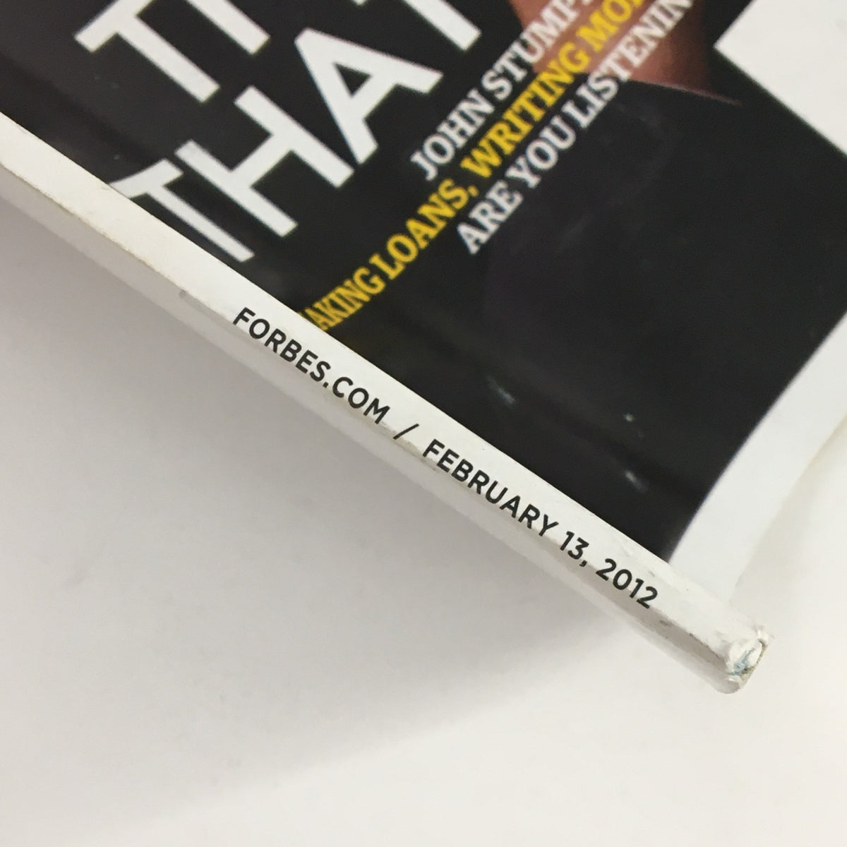 Detail view of the spine of Forbes Magazine February 13, 2012, featuring the date and publication name, focusing on John Stumpf.