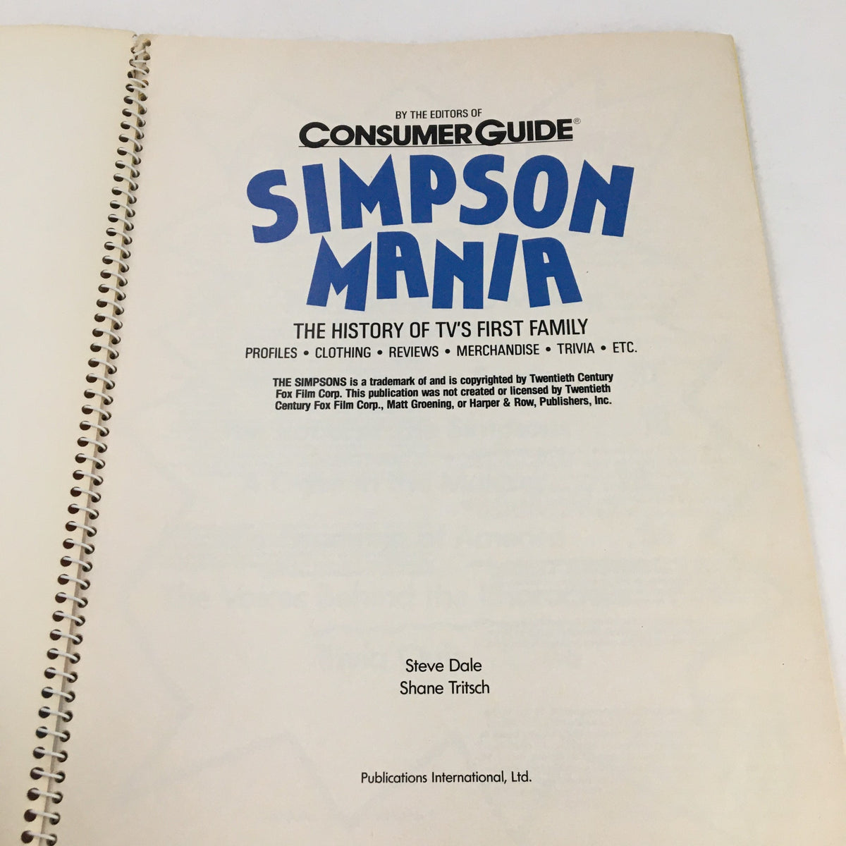 Title page of '1990 Consumer Guide Presents Simpson Mania The History of TV's First Family', featuring the book title and authors Steve Dale and Shane Tritsch.